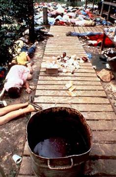 Bodies of members of the Peoples Temple who died after their leader Jim Jones ordered them to drink a cyanide-laced beverage. The vat that contained the poison is in the foreground. This photograph was located on britannica.com in "Jonestown Massacre".