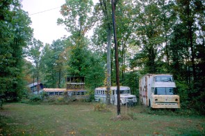 Abandoned vehicles, some of the original buses that came to the Farm from San Francisco, Calif., 1993. (Source: Don Janzen collection, CS 662, 070sc-0019)