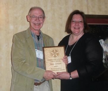 Don Janzen receives the 2011 project award for the outstanding collection of communal site photographs he developed for the Center for Communal Studies at the University of Southern Indiana, 2011. Source: Communal Studies Association Facebook Page.