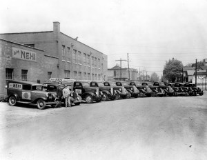 Fleet of delivery vehicles outside the Royal Crown/Nehi bottling plant at 400 N. Main St. It advertises, "Drink Nehi." This bottling plant no longer exists, n.d. Source: Double Cola Company, MSS 283-011.