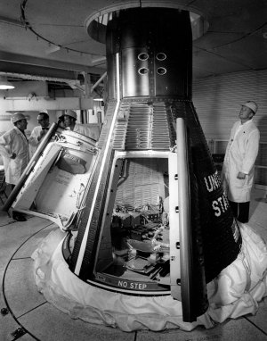 Astronauts are briefed on the first Gemini Spacecraft by Guenter Wendt, Design Engineer for McDonnell Aircraft Corp., in the Whiteroom at Launch Complex 19, Cape Kennedy, Fla." From left; Gus Grissom, Guenter Wendt, L. Gordon Cooper, Neil Armstrong.