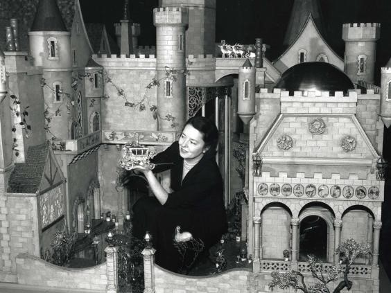 Colleen Moore in her Fairy Castle, holding Cinderella’s coach.