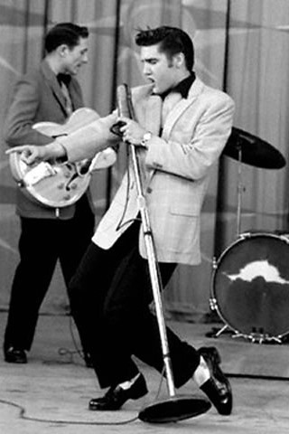 Elvis (center) performing on-stage, n.d. Source: https://www.graceland.com/1954-1957
