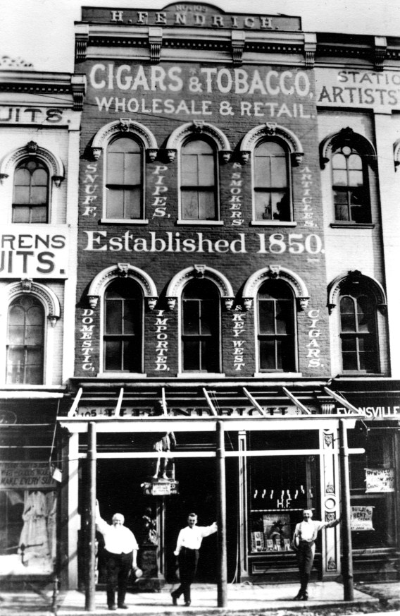 Hermann Fendrich, Harry Wright, and John Hermann Fendrich in front of the Old Fendrich Cigar Factory in Evansville, Indiana, 1885. Source: MSS 157-0506.