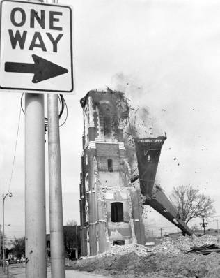 The spire of Assumption Catholic Church comes down. Source: Schlamp-Meyer Family collection, MSS 157-1574.