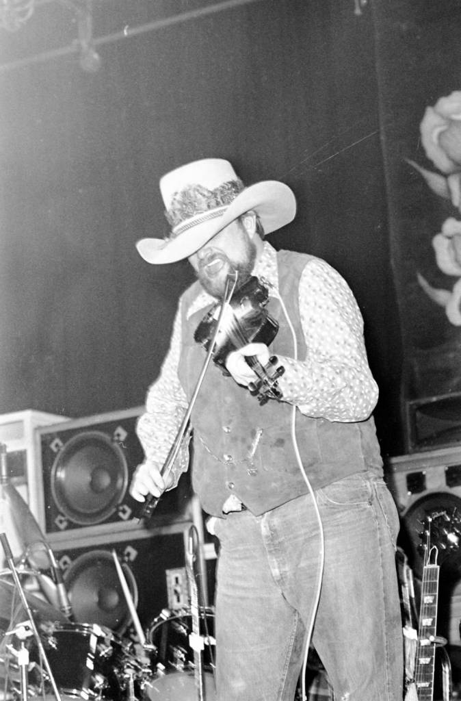 Charlie Daniels playing the fiddle at the Soldiers and Sailors Memorial Coliseum, 1977.