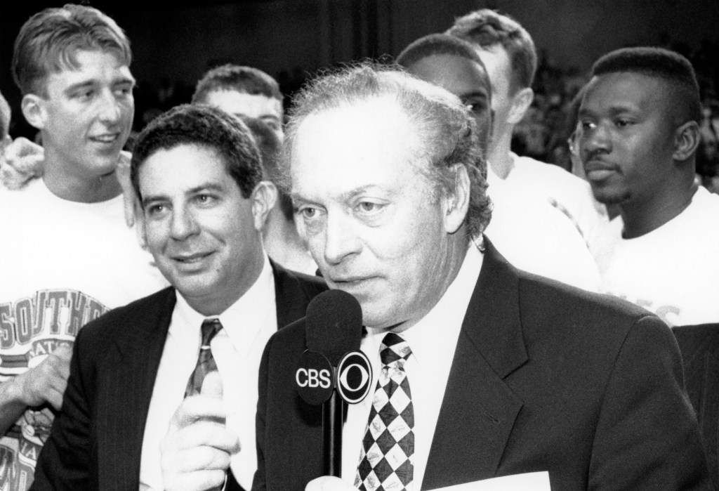 (L-R): Men's basketball player, Chad Gilbert, coach Bruce Pearl, Dick Stockton from CBS Sports, Scott Boyden, and Cortez Barnes, after winning the NCAA Division II Men's Basketball title, 1995. Source: UASC, UP 00524.