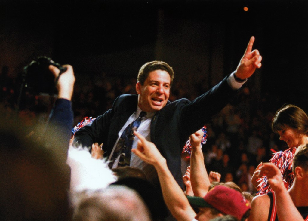 Men's basketball coach Bruce Pearl (center) after winning the NCAA Division II men's basketball championship, 1995. Source: UASC, UP 01382.