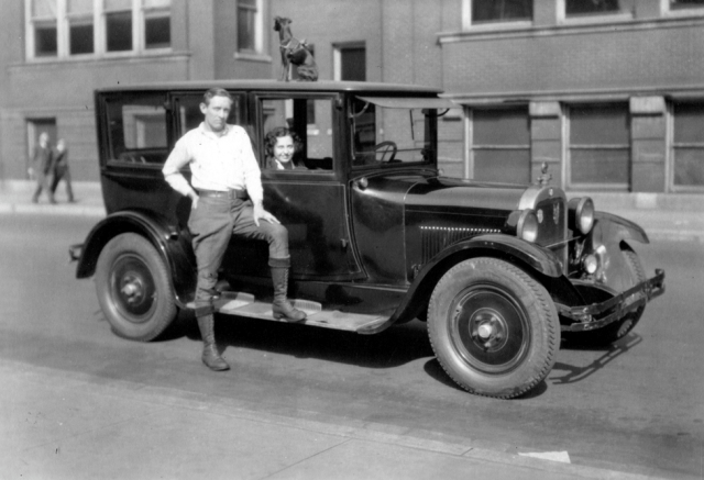 Man and woman with small dog